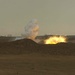 An 81mm white phosphorus mortar round bursts on impact