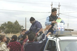 Police hand out candy and toys to local children
