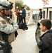 Staff Sgt. Betancourt speaks with an Iraqi youth