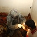 A Soldier checks a suspected terrorist for bomb making materials