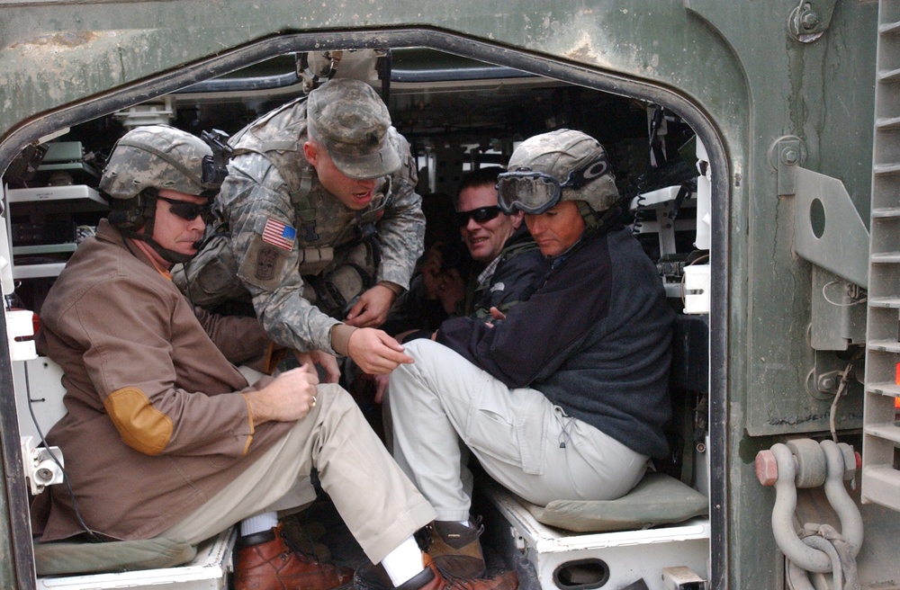 Delegates from Washington get a tour of a Stryker vehicle