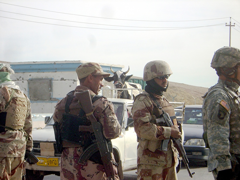 Soldiers operate a combined traffic control point in Mosul