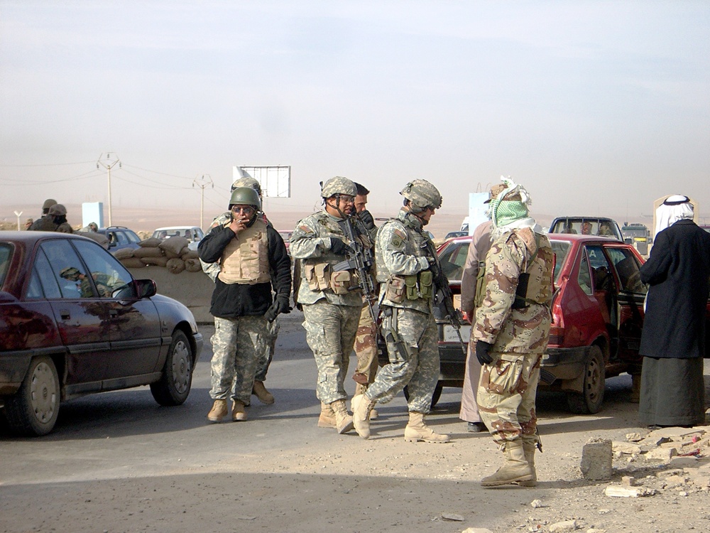 Soldiers operate a combined traffic control point in Mosul