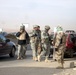 Soldiers operate a combined traffic control point in Mosul