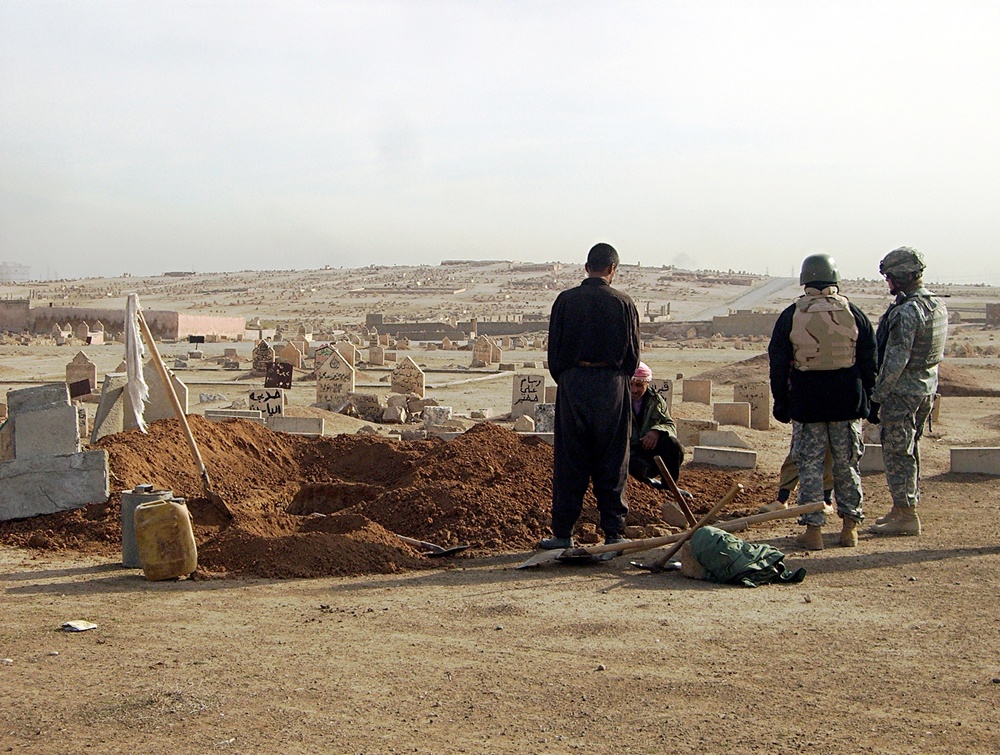 Soldiers tactical questioning of a grave digger