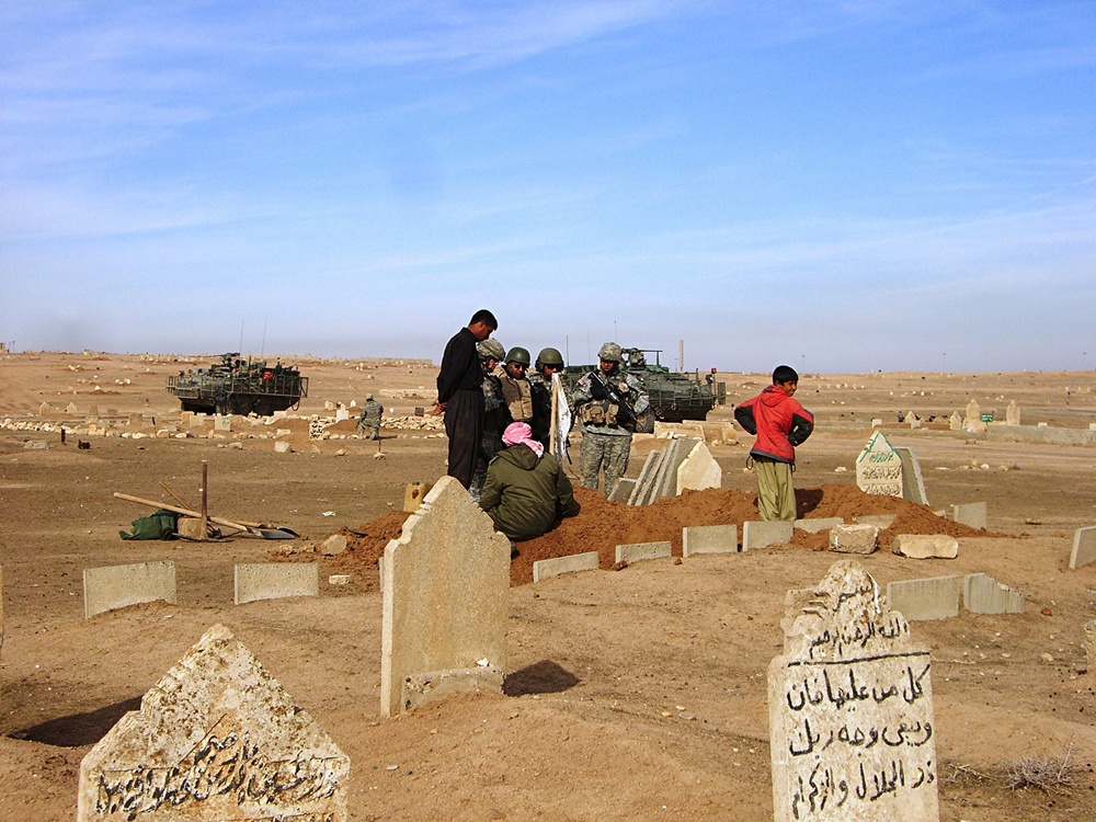 Soldiers tactical questioning of a grave digger