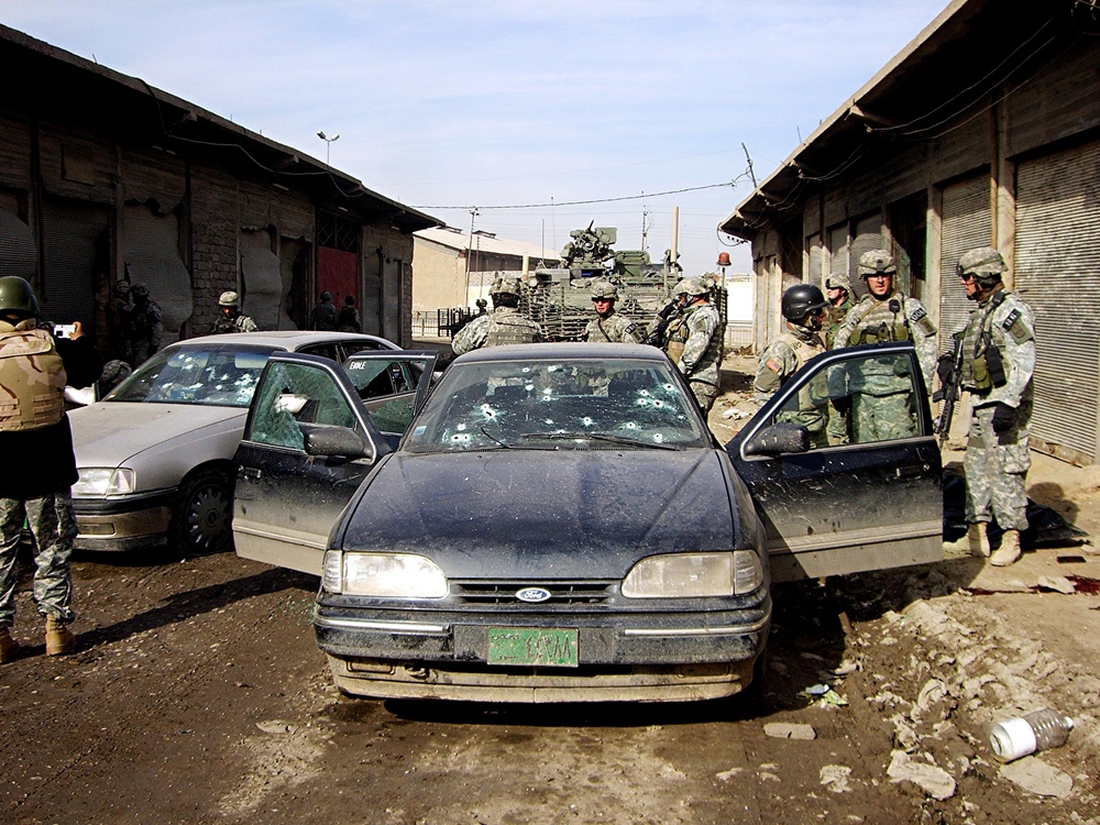 Soldiers conduct vehicle searches in Mosul