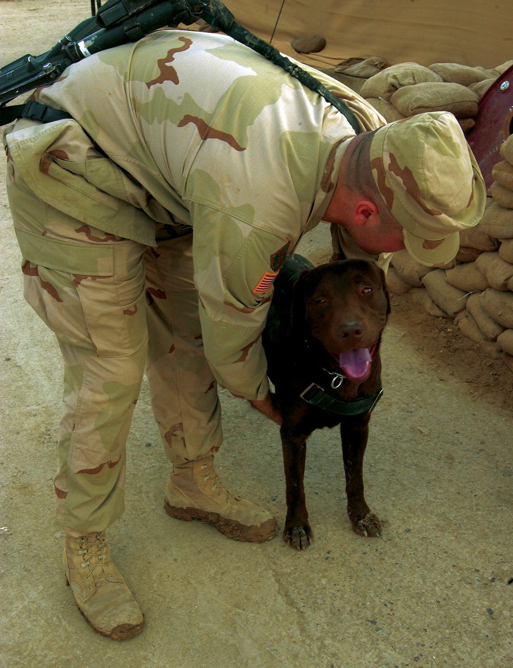Sgt. McKee Helps Staff Sgt. Archie Into His Work Harness