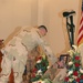 A troop places a coin on the memorial of Sgt. McMullen