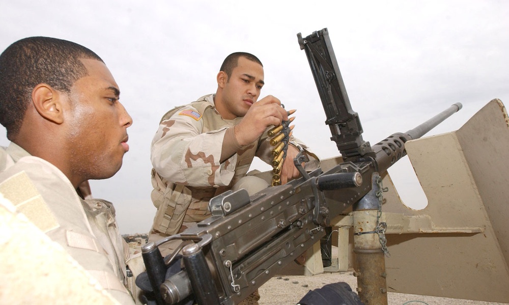Spc. Green Cleans His .50 Caliber Machine Gun