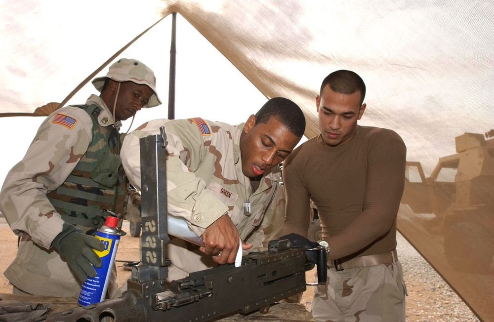 Spc. Green Cleans His .50 Caliber Machine Gun