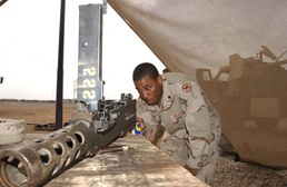Spc. Green Cleans His .50 Caliber Machine Gun