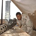 Spc. Green Cleans His .50 Caliber Machine Gun