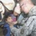 Spc. Radcliff listens for signs of asthma in a young Iraqi girl