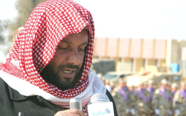 Sheik Achmed reads verses from the Koran