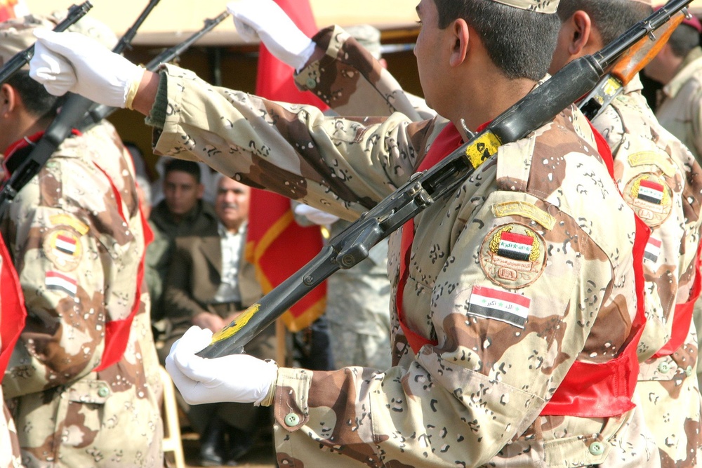 Iraqi troops pass in review