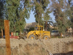 Front Loader Is Used to Clean Up Trash in Al-Rasheed
