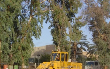 Front Loader Is Used to Clean Up Trash in Al-Rasheed