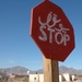 A stop sign, painted in both Arabic and English