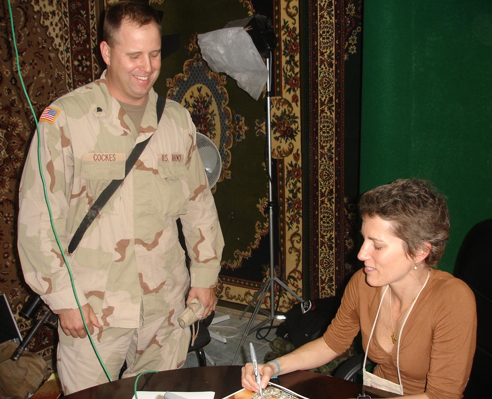 DVIDS - Images - Laura Ingraham Autographs a Photo for Spc. Cockes [Image 1  of 2]