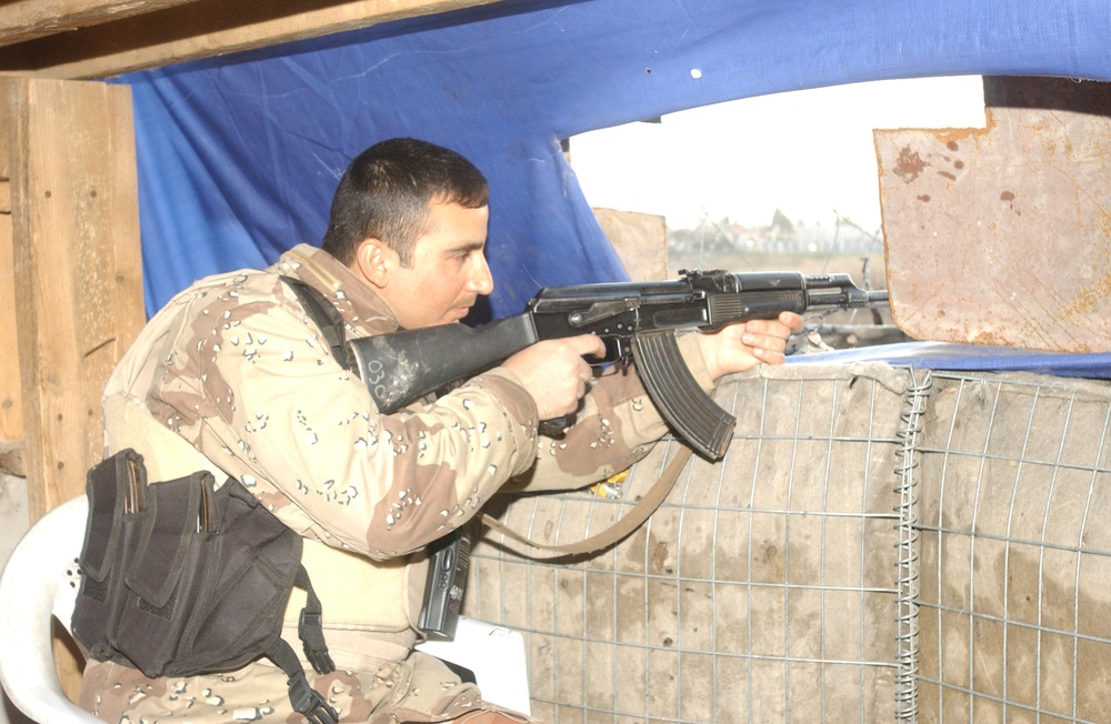 An Iraqi Soldier remains alert at his post