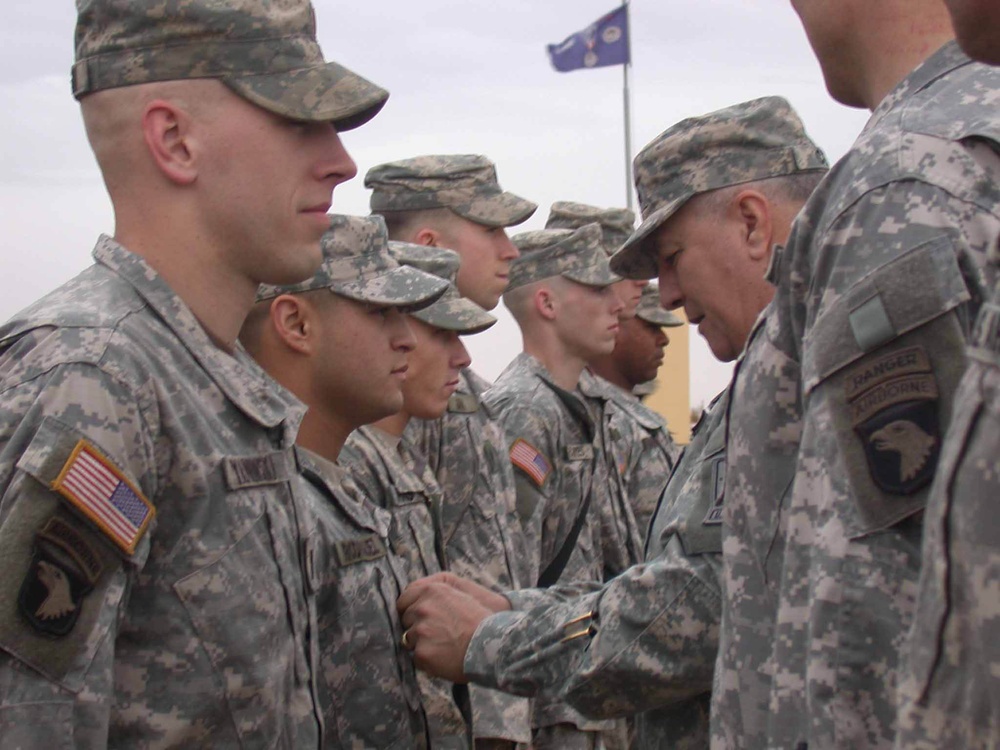 Gen. Cody pins new rank on Spc. Rodriguez