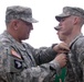 Gen. Cody pins a Purple Heart on Pfc. Graves