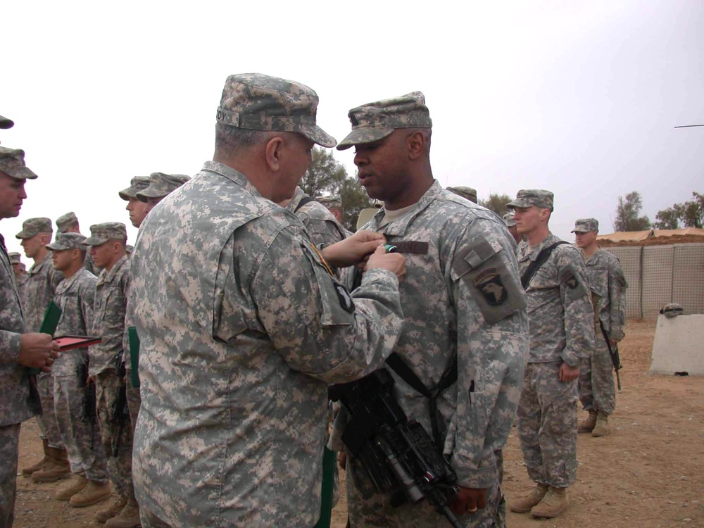 Gen. Cody pins an Army Commendation Medal on 1st Sgt. Johnson