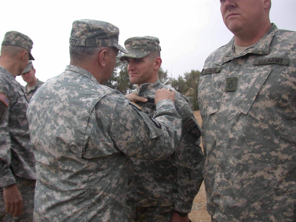 Gen. Cody pins a Combat Infantryman Badge on 2nd Lt. Pitkin