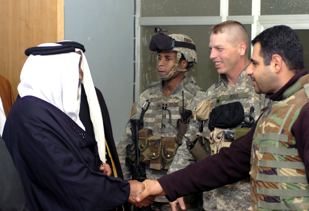 Sgt. Bozel works next to Lt. Col. Root