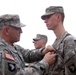 Gen. Cody Pins a  Purple Heart Medal on Pfc. Daniel Wilson