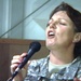 Staff Sgt. Newfrock hits a high note while  singing a song