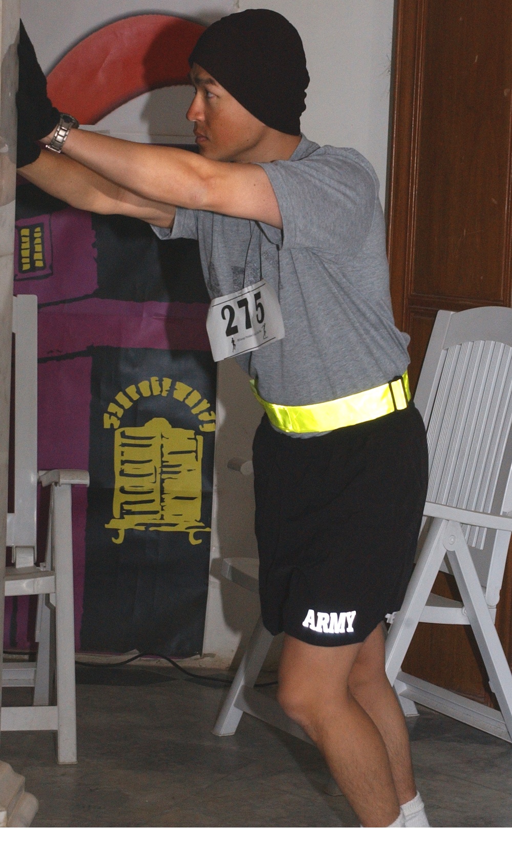 A Soldier stretches before a 5K run