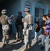Soldiers hand out school supplies