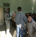 Soldiers hand out school supplies