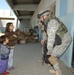 Soldiers hand out school supplies
