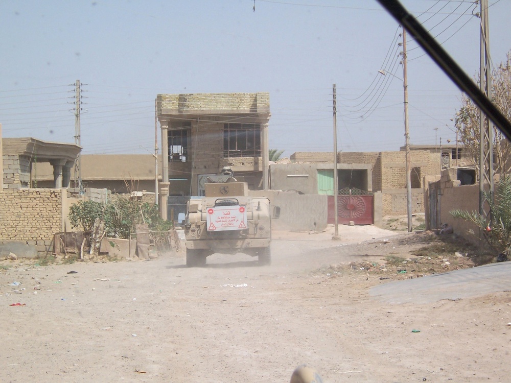 Military Police patrol the streets of Al Risallah