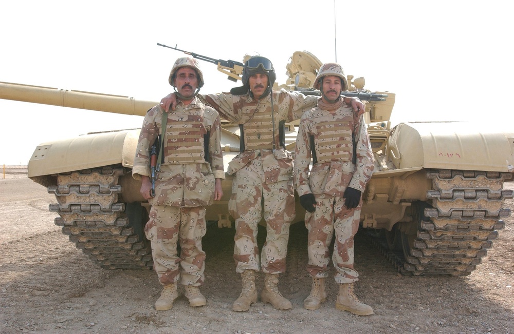 Iraqi Soldiers Stand in Front of Their T-72 Main Battle Tank