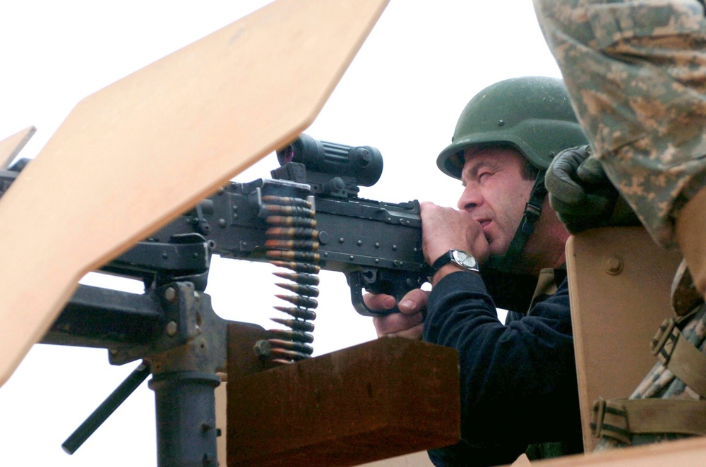 Comedian Mark Sweeney Fires a Light Machine Gun