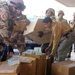 Iraqi Army Soldiers and hospital personnel unload medical supplies