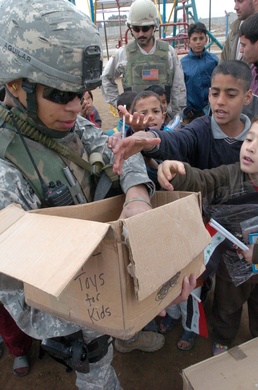 Spc. Aguilar Passes Out School Supplies