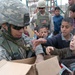 Spc. Aguilar Passes Out School Supplies