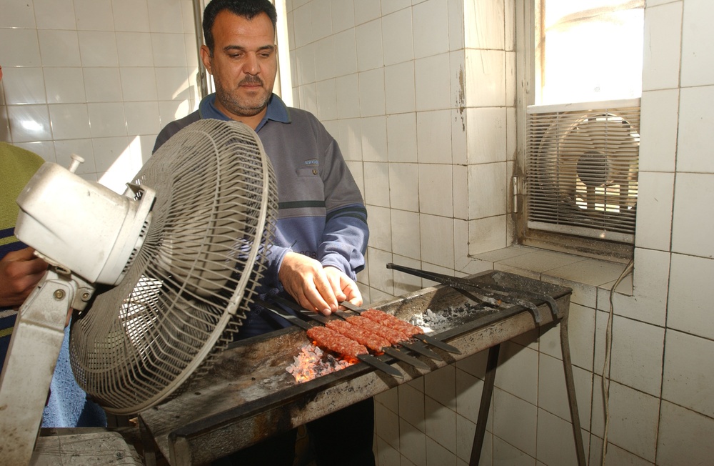 Cooking kabobs for Soldiers