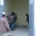 Iraqi Contractors Work on a Warehouse at Al Kisi