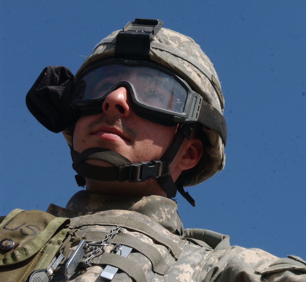 A Soldier stays alert while patrolling the streets of Tall Afar