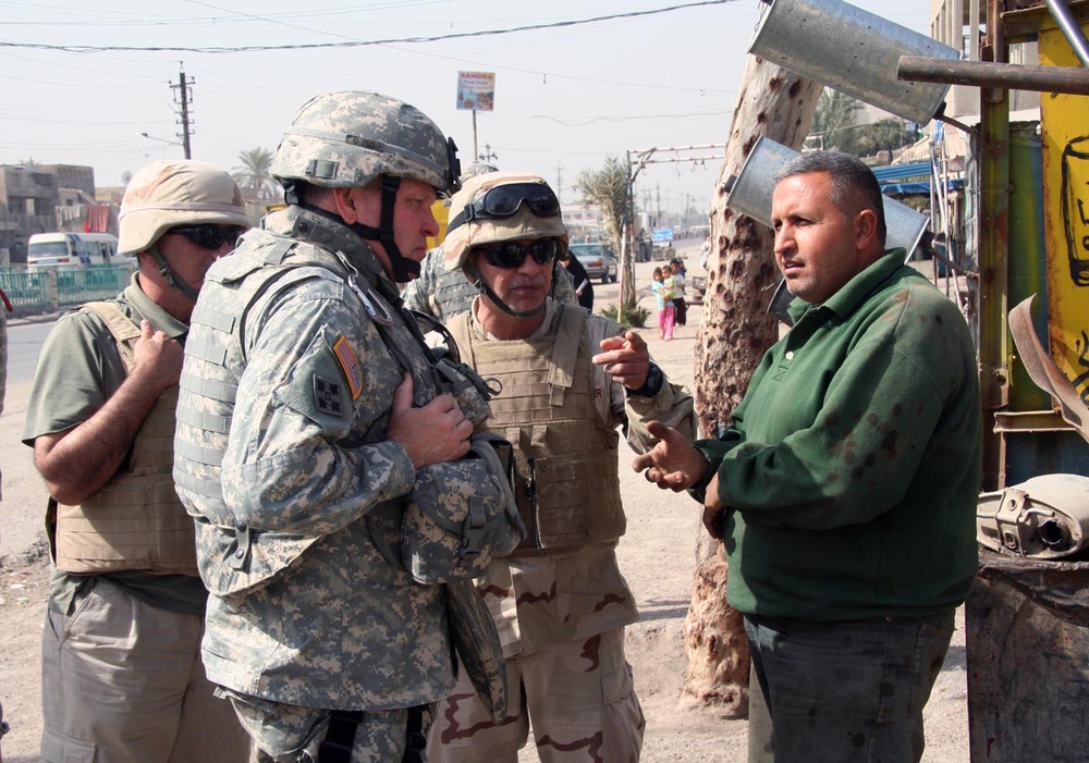 Maj. Gen. James D. Thurman MG Thurman meets with shop owner