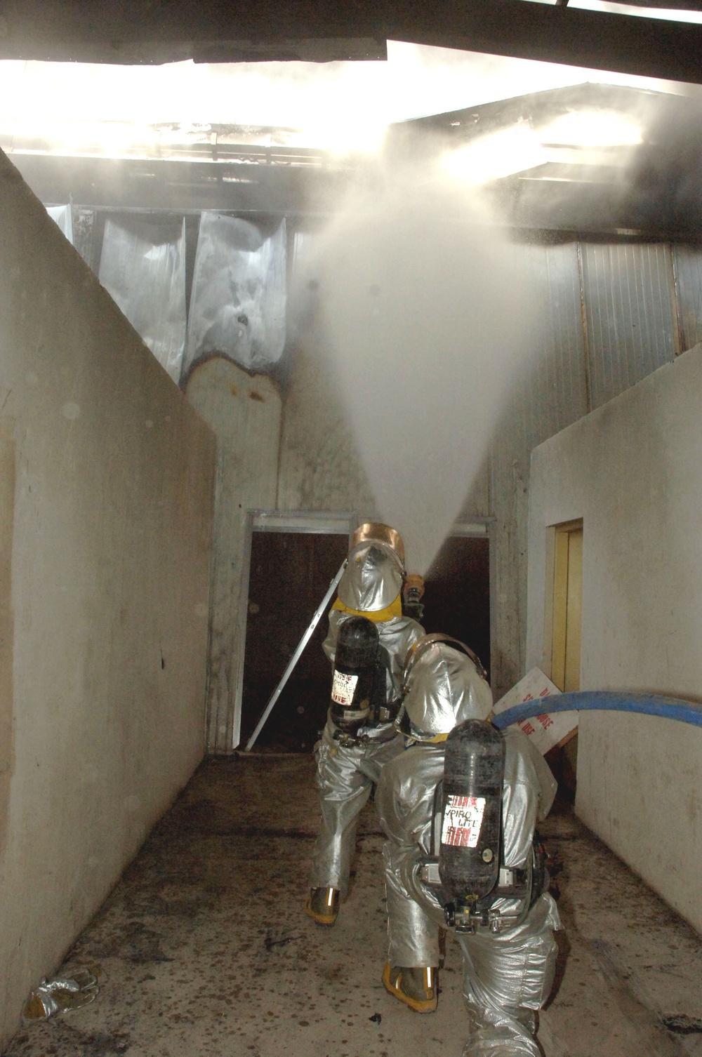 Iraqi, American firefighters battle blaze at weapons training si