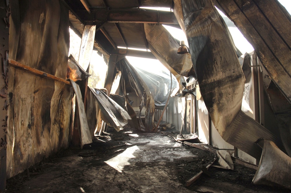 Iraqi, American firefighters battle blaze at weapons training si