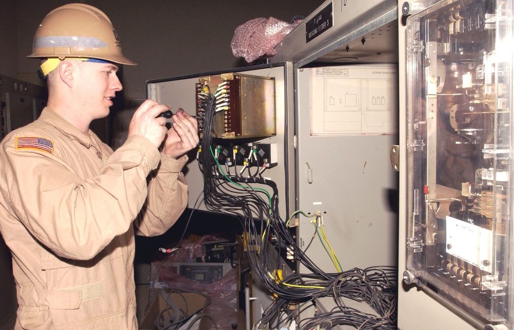 Sgt. Ganley replaces a circuit breaker