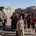 Soldiers hand out soccer balls in Tal Afar